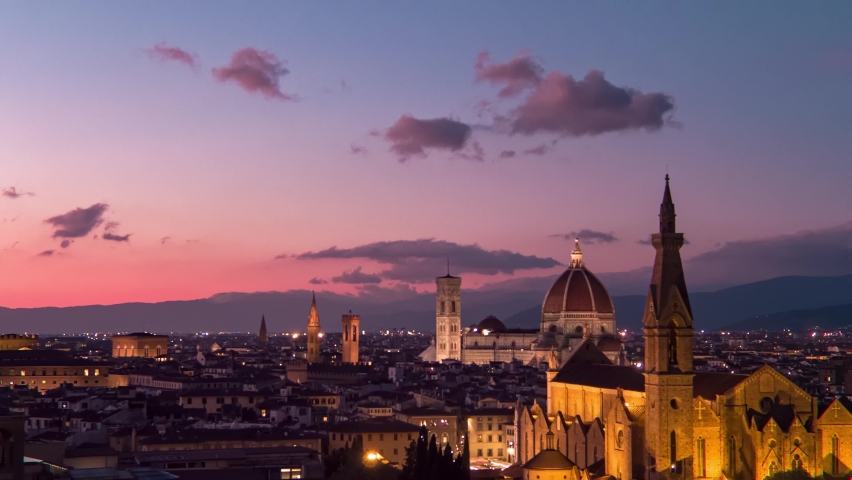 Establishing aerial view of Florence Cathedral, Firenze Cattedrale di Santa Maria del Fiore, Ponte Vecchio and Arno River on a beautiful purple sunset sky, Tuscany region of Italy Florence Royalty-Free Stock Footage #1092509209