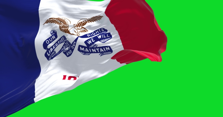 The flag of Iowa waving in the wind isolated on a green background. Iowa is a state located in the midwestern region of the United States. Seamless loop in slow motion