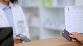 Closeup customer hands using ebanking credit card to pay on contactless nfc machine to collect prescription medication from pharmacist. Man tapping or scanning electronic device for pharmacy medicine - Powered by Shutterstock - Get 15% off with code: PIKWIZARD15