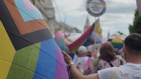 London , London , United Kingdom (UK) - 07 02 2022: Close up of Rainbow flag flying in slow motion at pride march