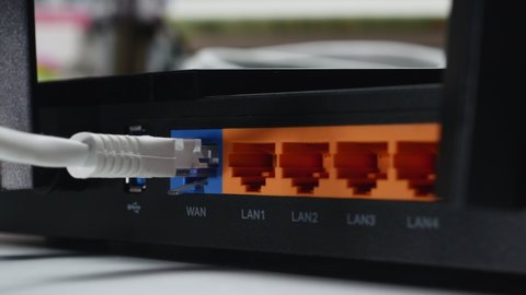 White WAN Ethernet Cable Connected To Wireless Wi-fi Router. Dolly Slider Shot. 4k. ProRes.