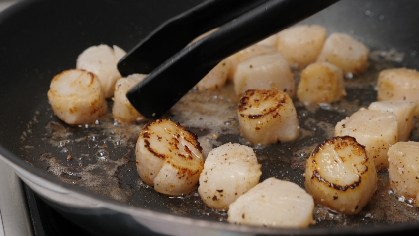 Cook scallops on frying pan. Cooking process