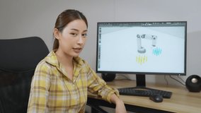 Asian Female Freelancer Working with Inspiration in her Studio. Concentrated Woman Creating her Own Project, She Trying to Explain How it Work to Camera.
