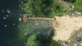 Drone video of people swimming in the lake