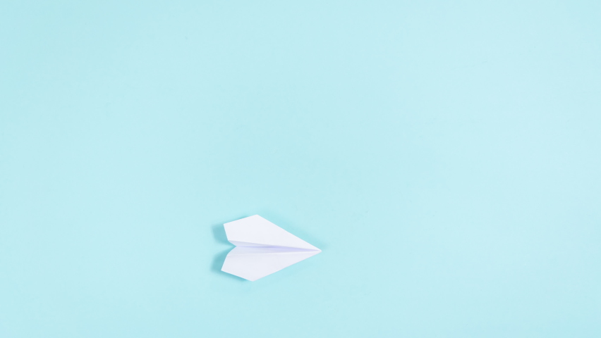 4k White paper airplane turns into an envelope that opens. Concept of delivering mail, letters and messages. Blue background. Stop motion animation. Flat lay. Copy space. Royalty-Free Stock Footage #1092543451