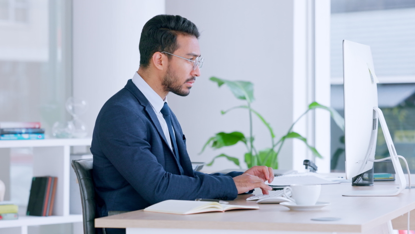 Stressed male business manager with a work headache on a computer. Frustrated office worker taking off his glasses while stressing about a deadline. Corporate leader at his desk tired of working. | Shutterstock HD Video #1092546463