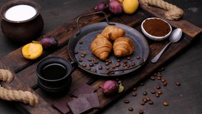 Croissant coffee and fruits. Close-up 4k video footage, white background