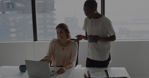 Animation of receiving and data processing over diverse female coworkers in office. Business, finance, data processing and technology concept digitally generated video.