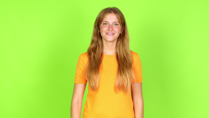 Young pretty blonde woman on green screen chroma key happy and counting with fingers over isolated background Royalty-Free Stock Footage #1092552349