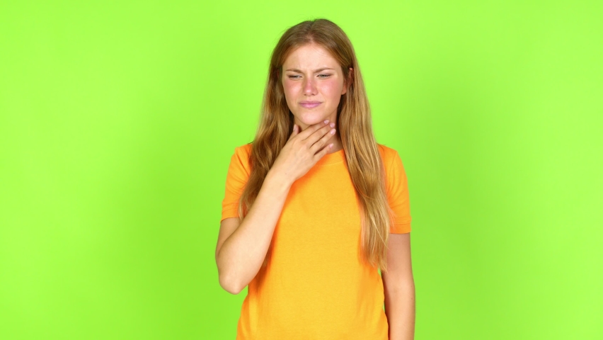 Young pretty blonde woman on green screen chroma key is suffering with cough and feeling bad over isolated background | Shutterstock HD Video #1092552363