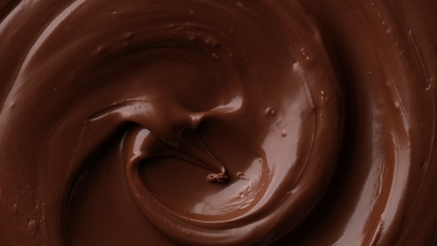 Zoom footage liquid dark chocolate top view. Confectionery concept Royalty-Free Stock Footage #1092558645