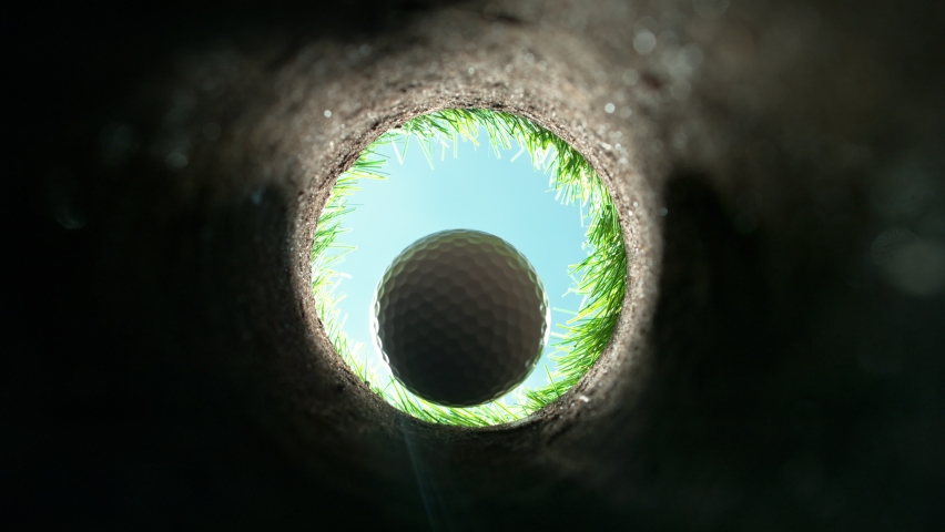 Super Slow Motion Shot of Golf Ball Falling Down Through Clay Hole at 1000 fps. | Shutterstock HD Video #1092563697