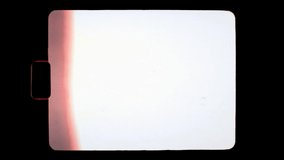 An old retro Super-8 mm film overlay, with a black round rectangular frame creating a central white blank space; red side burning effect. Put this clip over your content in multiply or screen mode.
