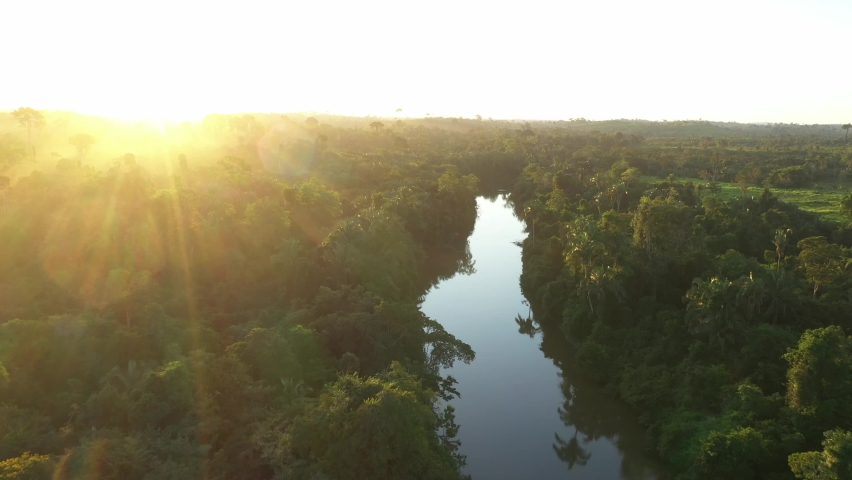 
Sun setting, over a river in the Amazon rainforest, drone, 4k Royalty-Free Stock Footage #1092567683