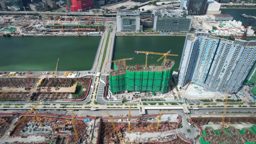 Commercial and residential construction development project in Kai Tak Cruise Terminal of Hong Kong city, Kwun Tong and Kowloon Bay near Victoria harbor, Aerial drone skyview | Shutterstock HD Video #1092575271
