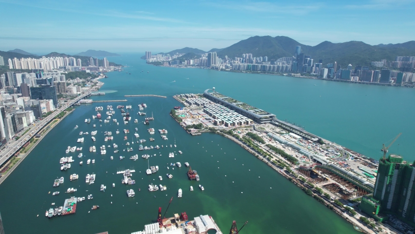 Commercial and residential construction development project in Kai Tak Cruise Terminal of Hong Kong city, Kwun Tong and Kowloon Bay near Victoria harbor, Aerial drone skyview | Shutterstock HD Video #1092575337