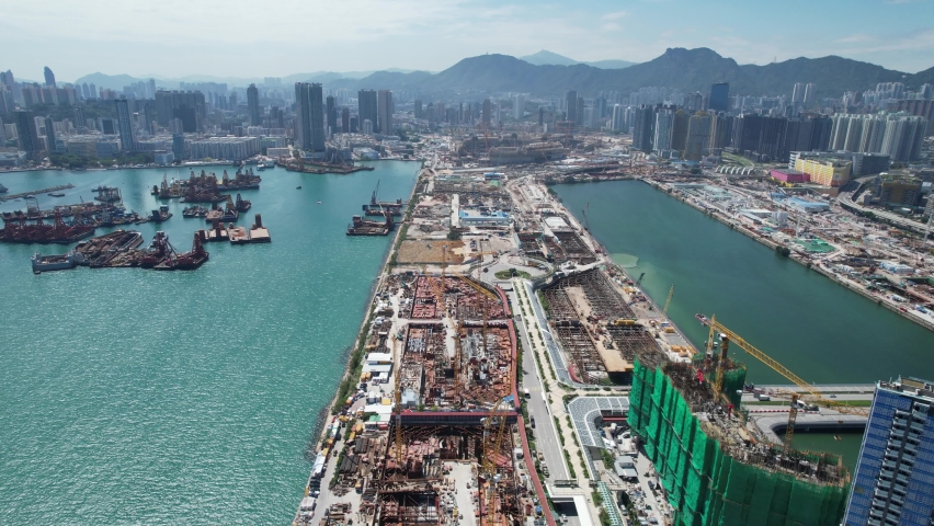 Commercial and residential construction development project in Kai Tak Cruise Terminal of Hong Kong city, Kwun Tong and Kowloon Bay near Victoria harbor, Aerial drone skyview | Shutterstock HD Video #1092575365