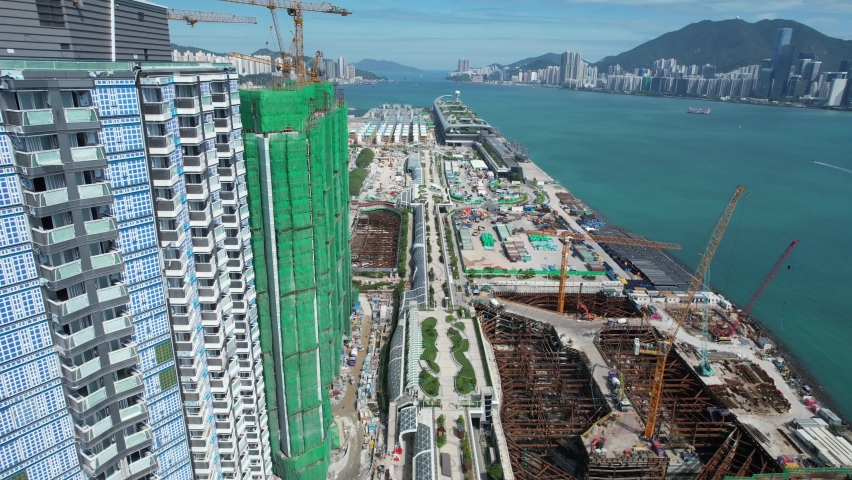 Commercial and residential construction development project in Kai Tak Cruise Terminal of Hong Kong city, Kwun Tong and Kowloon Bay near Victoria harbor, Aerial drone skyview | Shutterstock HD Video #1092575439