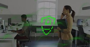Animation of padlock and shield over biracial businesswoman on phone walking through office. Global communication, business and data security concept digitally generated video.