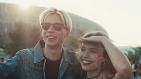Caucasian couple having fun on music festival together. Shot with RED helium camera in 8K. 