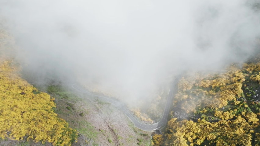 Foggy Sky Over Mountain Road At Pico do Arieiro In Madeira Island, Portugal. Aerial Drone Shot