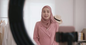 Islam Gen Z vlogger SME owner live talk on social media  reel stories or  shop platform Happy woman young asia arab r influencer selfie home video camera selling clothes online