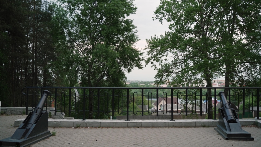 Battery in Borisov at site of battle of Russian Empire and French army by Napoleon Bonaparte. Two black cast-iron cannons are directed towards Berezina River at place where troops were crossing.