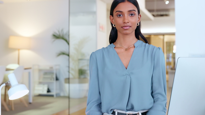 Portrait of proud business manager with her arms crossed in an assertive power stance. Smiling and confident young business woman and creative leader with her arms folded in a modern office Royalty-Free Stock Footage #1092617859