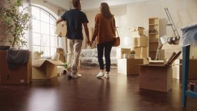 Family New Home Moving in: Happy and Excited Young Couple Enter Newly Purchased Apartment. Beautiful Family Happily Embracing. Modern Home Ready for Decorations. Mortgage Loan, Investment Concept - Powered by Shutterstock - Get 15% off with code: PIKWIZARD15