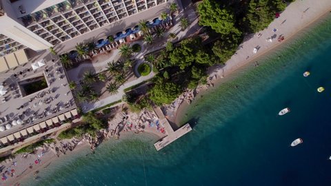 4k top down view of the hotel at the sea coast