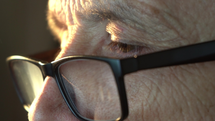 The eye of an older man wearing glasses. Side view. Royalty-Free Stock Footage #1092636729