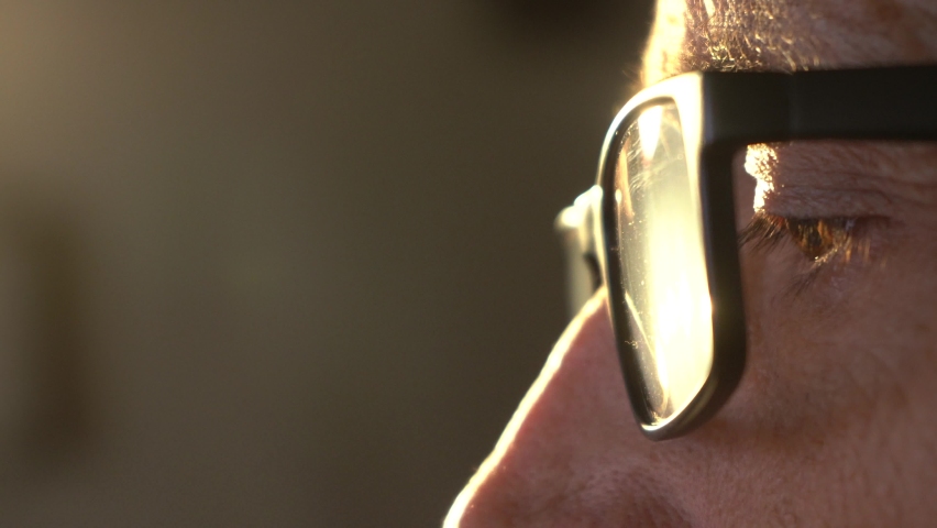 The eye of an older man wearing glasses. Side view. Royalty-Free Stock Footage #1092636733