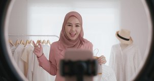 Islam Gen Z vlogger SME owner live talk on social media  reel stories or  shop platform Happy woman young asia arab r influencer selfie home video camera selling clothes online