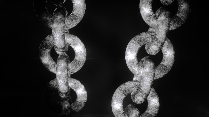 Abstract industrial background with metal large rusty chains hanging isolated on a black background. Motion. Silver chains, close up.