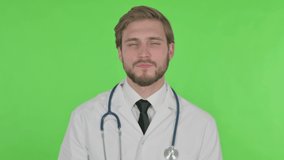 Young Doctor Talking on Online Video Call on Green Background 