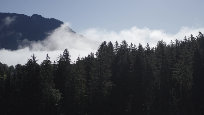 Berchtesgadener Land. Aerial flight 4K. Alps in Bavaria with fog and clouds