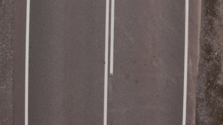 Chuya highway with traffic cars and mountains in valley of Altai, Siberia, Russia. Beautiful summer nature landscape at during daytime. Aerial view from a drone