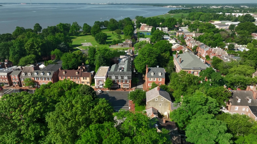 New Castle Delaware River aerial establishing shot. Restored quaint homes in colonial village in USA.