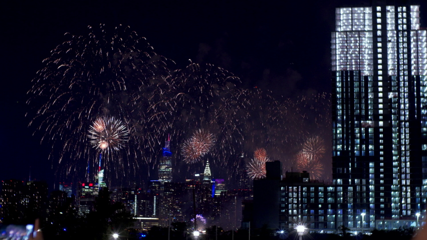 Magnificent fireworks over New York at Independence day, 4th of July. View Manhattan view from Queens borough, Empire State building is on the left  | Shutterstock HD Video #1092682525