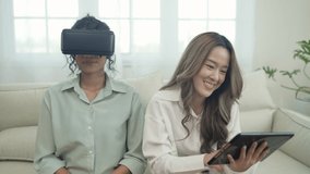 Holiday concept of 4k Resolution. Asian women use vr together in the living room. virtual reality technology.