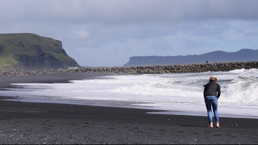 Woman on Black Beach Iceland Walking