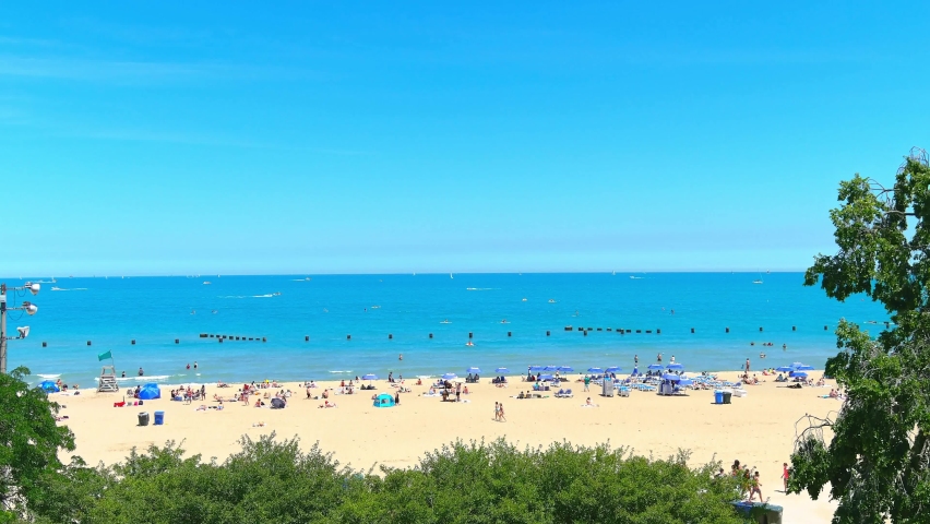 Ascending aerial shot of North Avenue beach in Chicago Illinois. Lake Michigan in background | Afternoon lighting