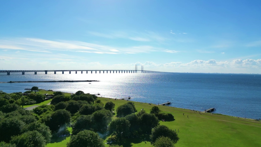 Malmö Verdant Coastline Overlooking Oresund Bridge And Copenhagen In Sweden. Aerial Wide Shot