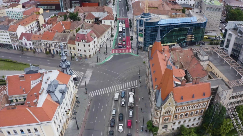 Aerial daytime view above downtown Cluj, Romania. Historical buildings and traffic