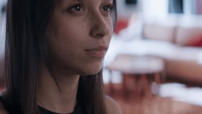 CU Portrait of Hispanic female using her VR metaverse headset at home