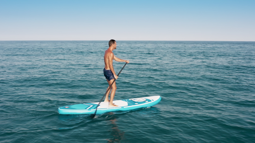 Man surfing On Sup Board