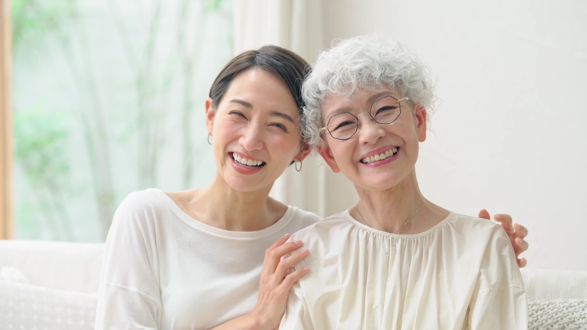 Asian elderly woman and middle aged woman smiling in the room. Royalty-Free Stock Footage #1092704827