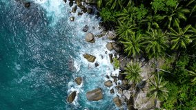 Professional video 4k Aerial view high angle view Video slow motion top-view of rock beach sea coasting in island Phuket Thailand. Tropical sea Andaman sea Location Phuket Thailand. 