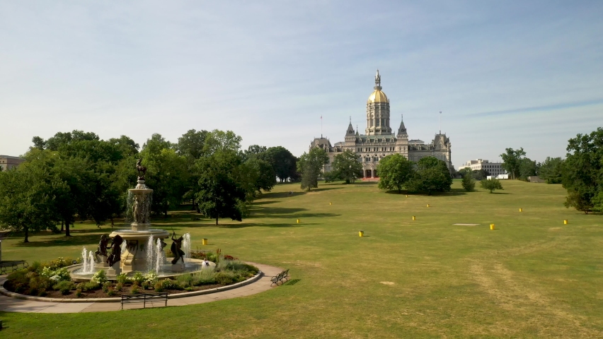Connecticut state capitol building in Hartford, Connecticut with fountain with drone video moving in and up.