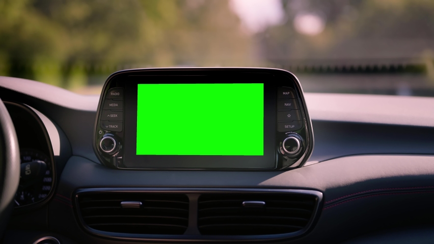 Close up display with green screen on car panel, car driving with navigation concept, blank screen dashboard. Royalty-Free Stock Footage #1092724113
